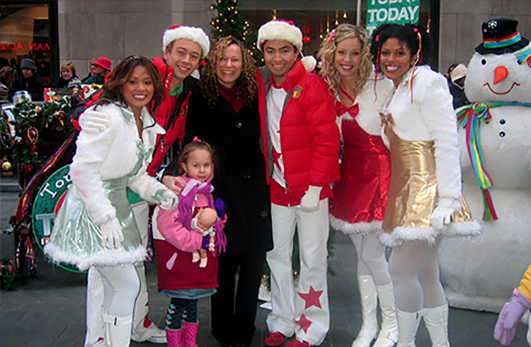Alison Grand and daughter, Sage, share some holiday cheer with Hi-5 on the Plaza at NBC’s Today