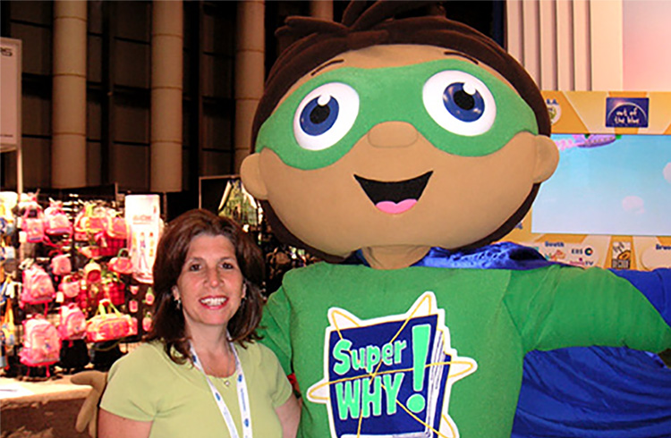 The literacy-powered star of Super WHY! comes to the “rescue” of Grand Communications’ Laura Liebeck at International Licensing Show in New York