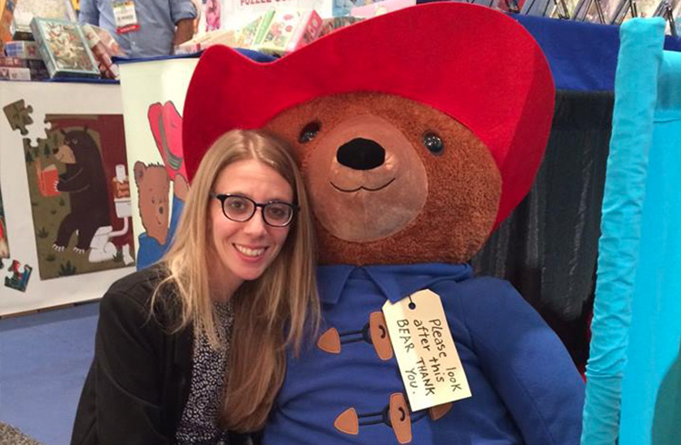 Jaymie Ivler of Grand Communications with YOTTOY’s larger-than-life Big Screen Paddington Bear at New York International Toy Fair